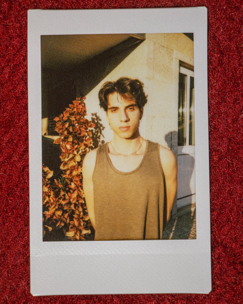 Polaroid front profile of Pedro Flynn at golden hour