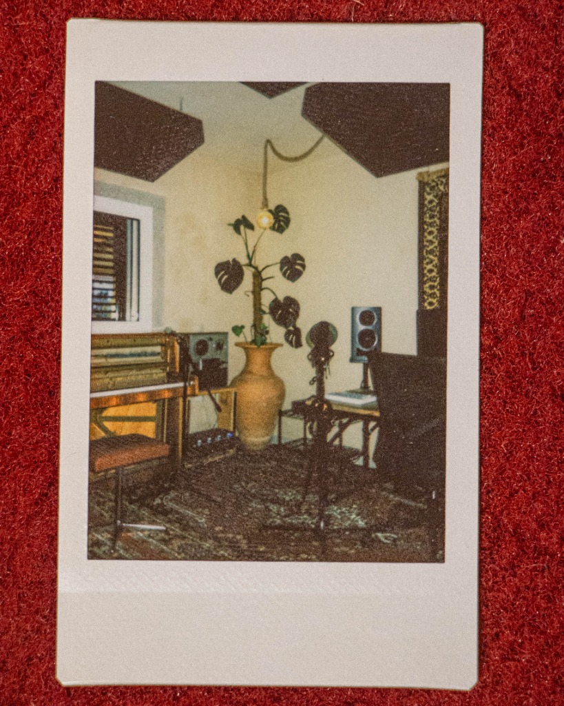 Polaroid of a music studio corner